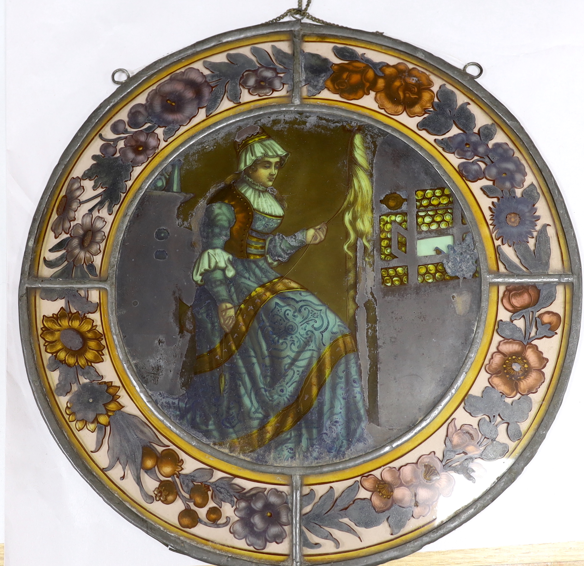 Two Victorian stained glass leaded roundels, one depicting a gentleman playing a lute, 32cm in diameter